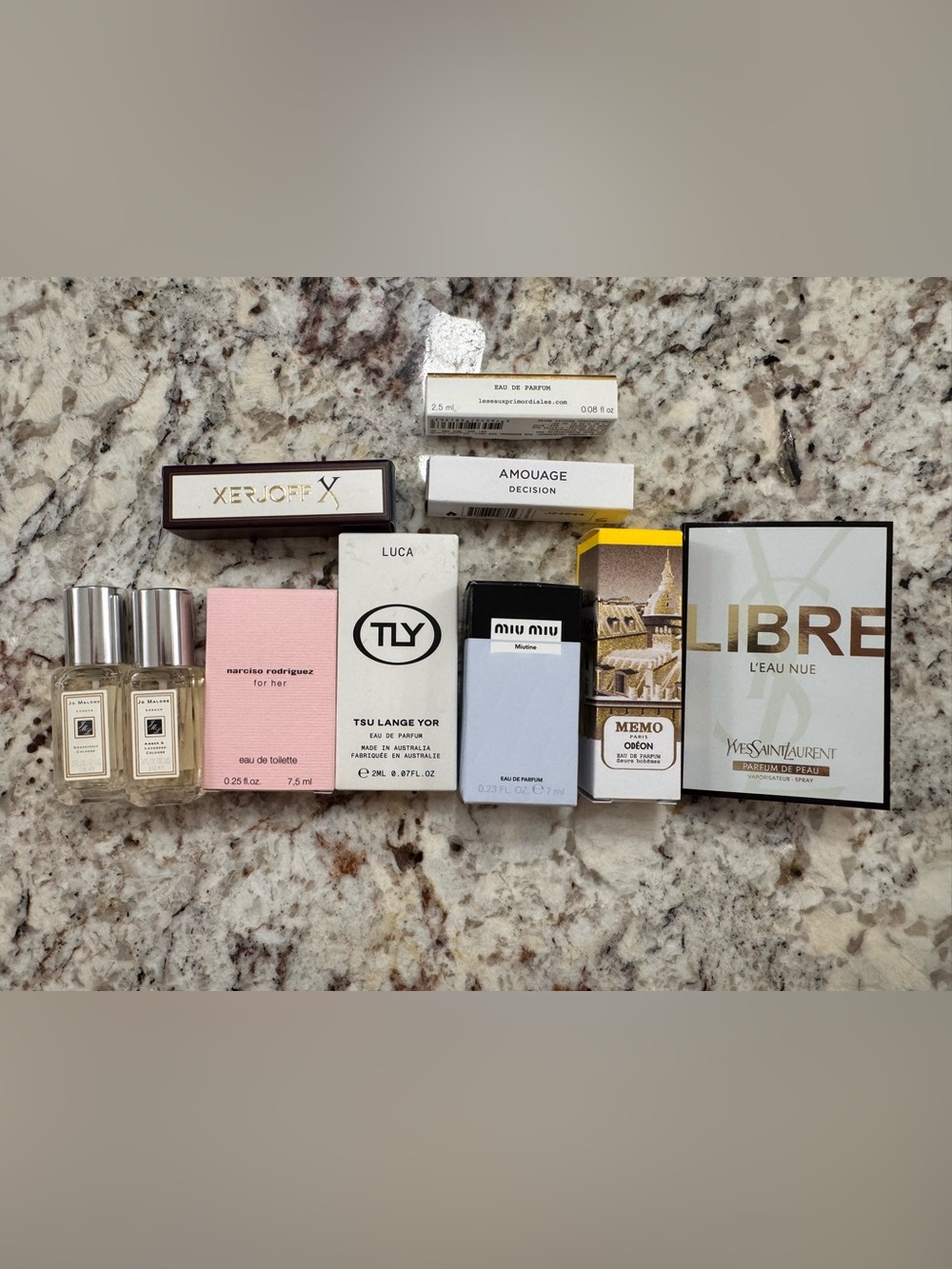 Assorted lot of sample or travel size perfumes. Unused.